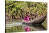 Woman Rowing Traditional Pirogue Down Du River, Monrovia, Liberia-Alida Latham-Stretched Canvas