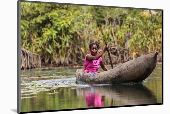 Woman Rowing Traditional Pirogue Down Du River, Monrovia, Liberia-Alida Latham-Mounted Photographic Print