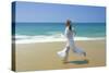 Woman Running Along Beach, Kovalam, Kerala State, India-Gavin Hellier-Stretched Canvas