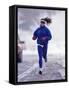 Woman Running During a Snow Storm-null-Framed Stretched Canvas