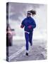 Woman Running During a Snow Storm-null-Stretched Canvas