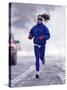 Woman Running During a Snow Storm-null-Stretched Canvas