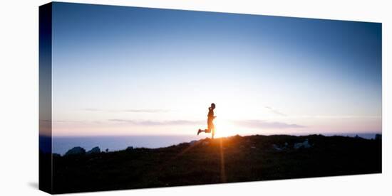 Woman Runs Along a Trail Above the California Coast North of San Francisco-Steven Gnam-Stretched Canvas