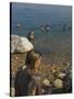 Woman's Back Covered with Mud and People Floating in the Sea in Background, Dead Sea, Israel-Eitan Simanor-Stretched Canvas