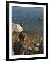 Woman's Back Covered with Mud and People Floating in the Sea in Background, Dead Sea, Israel-Eitan Simanor-Framed Photographic Print