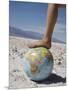 Woman's Foot on Globe, Bad Waters Point, Death Valley National Park, California, USA-Angelo Cavalli-Mounted Photographic Print