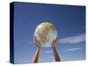 Woman's Hands Holding Globe, Death Valley National Park, California-Angelo Cavalli-Stretched Canvas