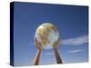 Woman's Hands Holding Globe, Death Valley National Park, California-Angelo Cavalli-Stretched Canvas