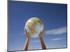 Woman's Hands Holding Globe, Death Valley National Park, California-Angelo Cavalli-Mounted Photographic Print