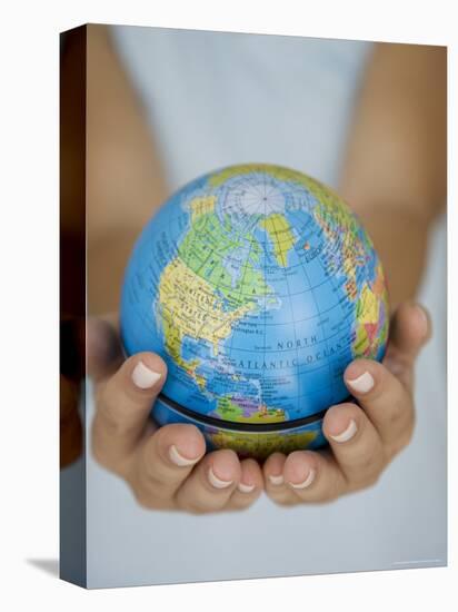 Woman's Hands Holding World Globe-Angelo Cavalli-Stretched Canvas