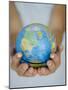 Woman's Hands Holding World Globe-Angelo Cavalli-Mounted Photographic Print