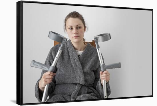 Woman Seated with Crutches-Anthony West-Framed Stretched Canvas