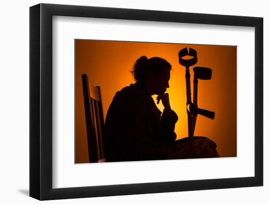 Woman Seated with Crutches-Anthony West-Framed Photographic Print