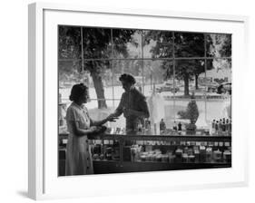 Woman Shopping For Cosmetics-Alfred Eisenstaedt-Framed Photographic Print