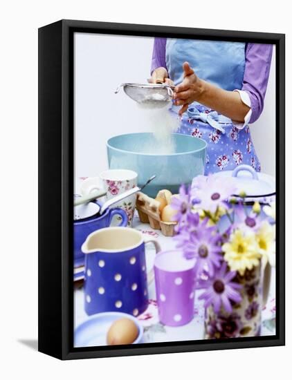 Woman Sieving Flour into a Bowl, Crockery & Eggs in Front-Linda Burgess-Framed Stretched Canvas