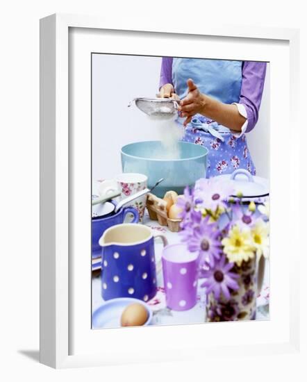 Woman Sieving Flour into a Bowl, Crockery & Eggs in Front-Linda Burgess-Framed Photographic Print