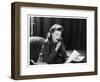 Woman Sits with Her Pen in Her Mouth Whilst Thinking About What She Should Write in Her Letter-null-Framed Art Print