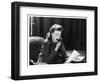 Woman Sits with Her Pen in Her Mouth Whilst Thinking About What She Should Write in Her Letter-null-Framed Art Print