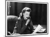 Woman Sits with Her Pen in Her Mouth Whilst Thinking About What She Should Write in Her Letter-null-Mounted Art Print