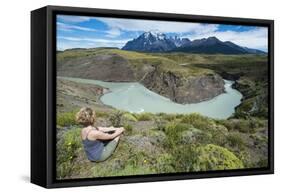 Woman Sitting Above a River Bend in Front of the Torres Del Paine National Park-Michael Runkel-Framed Stretched Canvas