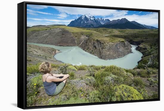 Woman Sitting Above a River Bend in Front of the Torres Del Paine National Park-Michael Runkel-Framed Stretched Canvas