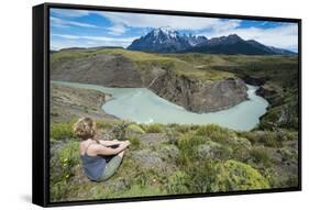 Woman Sitting Above a River Bend in Front of the Torres Del Paine National Park-Michael Runkel-Framed Stretched Canvas