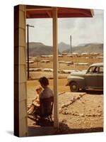 Woman Sitting in Rocking Chair on Veranda Playing with Baby on Her Lap-Andreas Feininger-Stretched Canvas