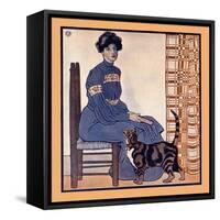 Woman Sitting On A Chair Holding A Book With A Cat Looking On-Edward Penfield-Framed Stretched Canvas