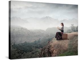 Woman Sitting On A Suitcase And Reading A Book With Landscape On The Background-olly2-Stretched Canvas