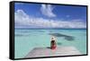 Woman Sitting on Jetty, Fakarava, Tuamotu Islands, French Polynesia (Mr)-Ian Trower-Framed Stretched Canvas