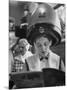 Woman Sitting under Hair Dryer Reading a Magazine-Gordon Parks-Mounted Photographic Print