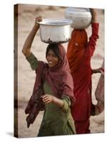 Woman Smiles after Collecting Drinking Water, on the Outskirts of Islamabad, Pakistan-null-Stretched Canvas