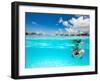 Woman Snorkeling in Clear Tropical Waters in Front of Overwater Villas-BlueOrange Studio-Framed Photographic Print