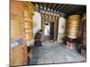 Woman Spinning a Prayer Wheel, Jambay Lhakhang, Built 659 by Tibetan King Songtsen Gampo, Bhutan-Christian Kober-Mounted Photographic Print