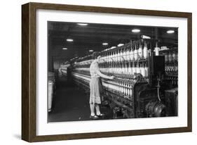 Woman Standing at Long Row of Bobbins, at a Textile Factory-null-Framed Premium Photographic Print