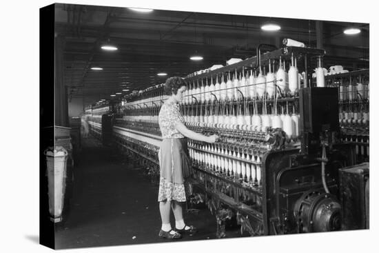 Woman Standing at Long Row of Bobbins, at a Textile Factory-null-Stretched Canvas