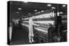 Woman Standing at Long Row of Bobbins, at a Textile Factory-null-Stretched Canvas