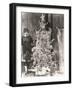 Woman Standing by Decorated Christmas Tree-null-Framed Photo