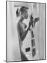 Woman Standing in Bathtub "Demonstrating" Various Gadgets for the Improvement of Bathing-Peter Stackpole-Mounted Photographic Print