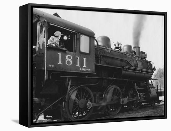 Woman Standing in Driver's Cabin in Locomotive-null-Framed Stretched Canvas