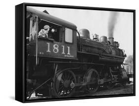Woman Standing in Driver's Cabin in Locomotive-null-Framed Stretched Canvas