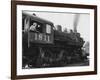 Woman Standing in Driver's Cabin in Locomotive-null-Framed Photo