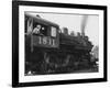 Woman Standing in Driver's Cabin in Locomotive-null-Framed Photo