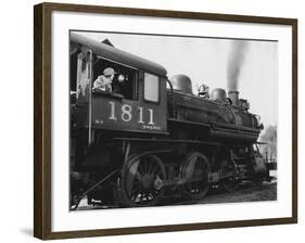 Woman Standing in Driver's Cabin in Locomotive-null-Framed Photo