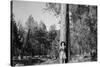 Woman Stands With Her Arms Wrapped Around A Ponderosa Pine Tree Looking Up And Smiling-Hannah Dewey-Stretched Canvas