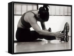 Woman Stretching During a Workout, New York, New York, USA-Paul Sutton-Framed Stretched Canvas