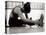 Woman Stretching During a Workout, New York, New York, USA-Paul Sutton-Stretched Canvas