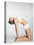 Woman stretching in camel pose-Mario Castello-Stretched Canvas