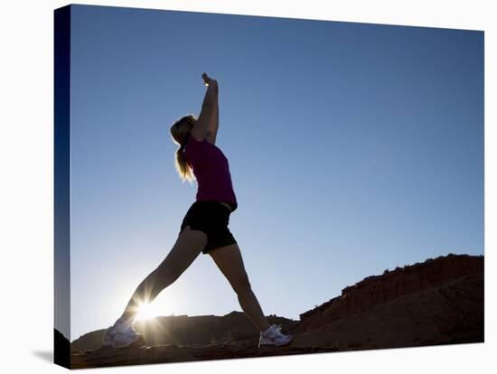 Woman Stretching, Monument Valley Navajo Tribal Park, Arizona Utah Border-Angelo Cavalli-Stretched Canvas