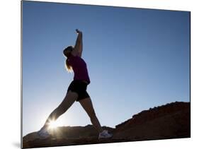 Woman Stretching, Monument Valley Navajo Tribal Park, Arizona Utah Border-Angelo Cavalli-Mounted Photographic Print